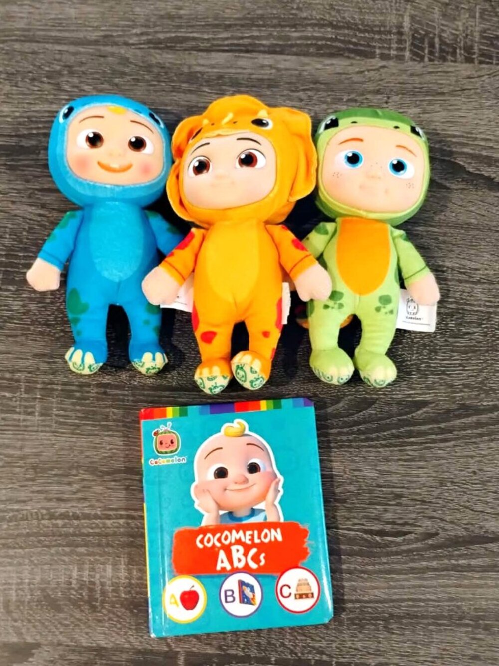 CoComelon 8 inch JJ, Nico & Cece Plush Dinosaurs with ABC's Book